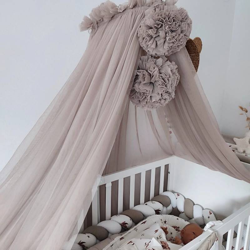 Tulle canopy bed in taupe with 2 pom-poms (main image)